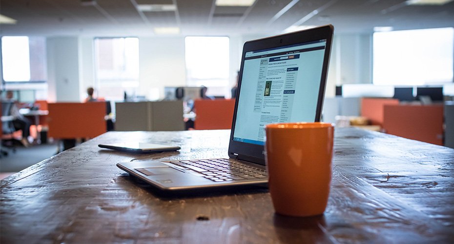 laptop and coffee cup ready to study for an online education degree