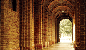 cloistered brick campus hallway