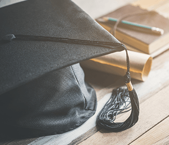 graduation cap degree and notebook with pencil together