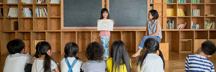 young student makes presentation to her class
