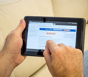 older student using tablet to take online degree program