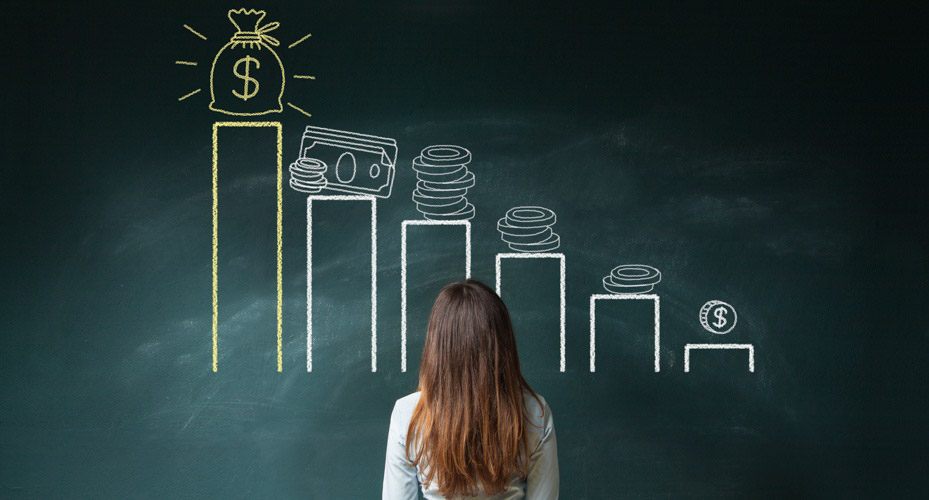 woman standing in front of chalkboard displaying graphic drawing depicting increasing money